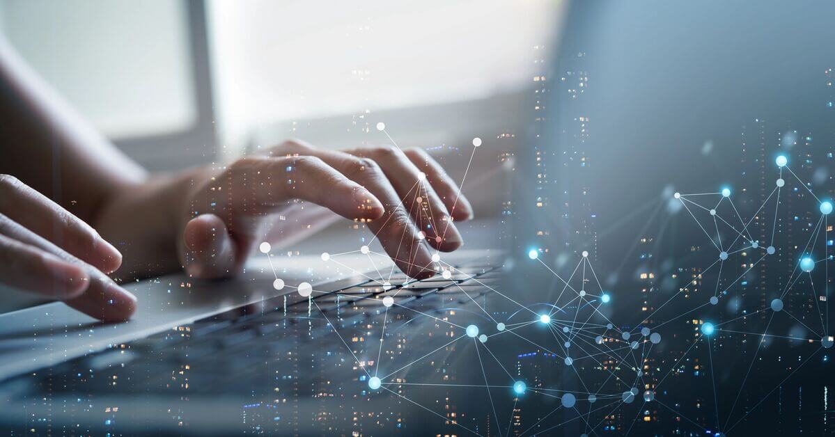 cropped image of hands typing on a laptop